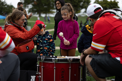 Photo of children playing drums with the KC Rumble Drumline