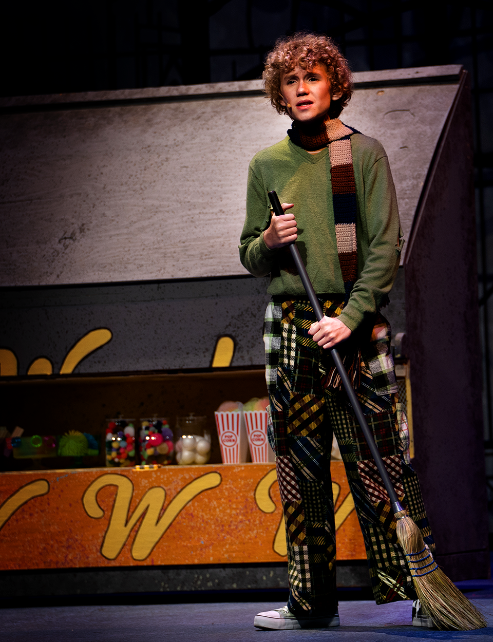 Charlie sweeping in front of the candy shop