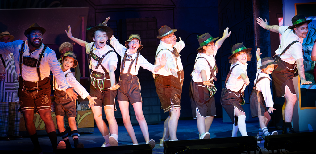 dancers in liederhosen in dancing pose