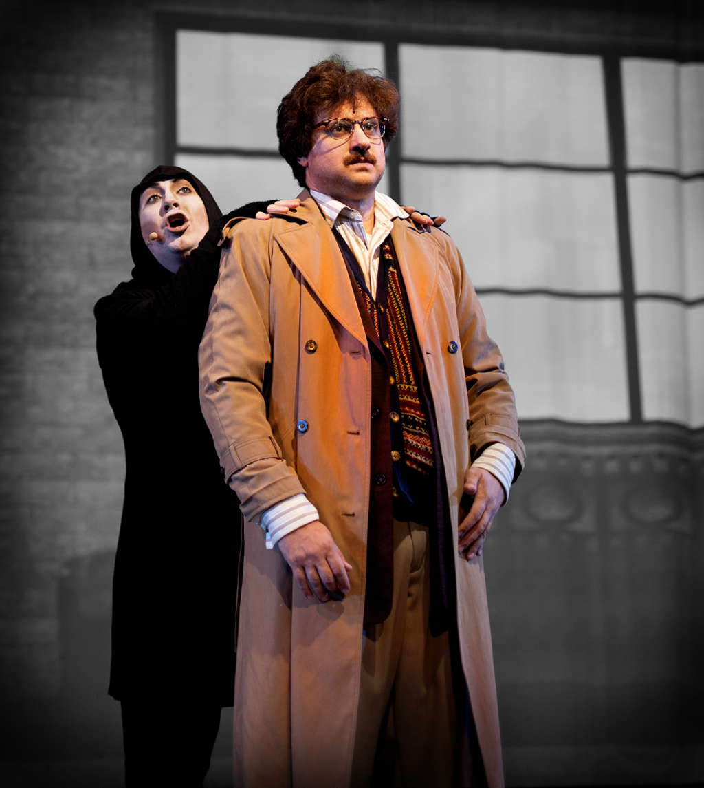 actors playing Dr. Frankenstein and Igor standing on stage during a scene