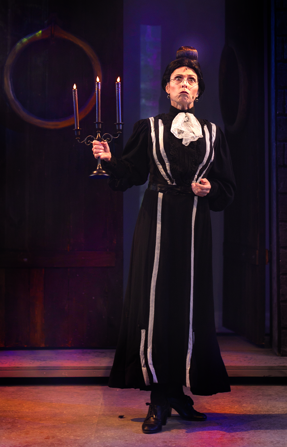 Actress playing Frau Bleucher singing during a scene