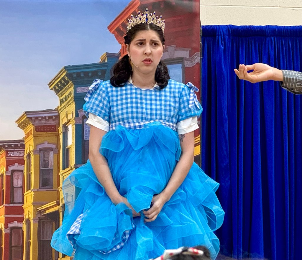 Photo of Elise Bowles playing DORA, a character based off of Dorothy from the Wizard of Oz